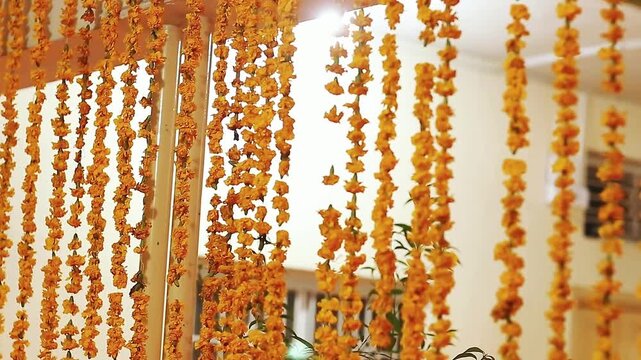 Wedding decor accessories for pakistani and Indian wedding, genda phool decoretion toran in wedding function, orange Marigold flowers arranged in alternate order, Beautiful marigold flowers wedding
