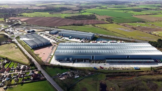 High angle aerial view of a large industrial logistics park and business district in Bawtry UK featuring modern warehouses and factories.
