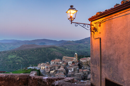 Mistretta village at dusk with lit street lamp, Sicily