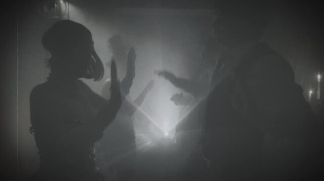 1920s style black and white color old film, shadow silhouette group of people dancing crowd in dark night out club. Women men flapper have fun joy at dance floor retro party rave 20s, roaring twenties