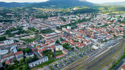 Obraz premium Aerial view of the old town above the city of Saint-Die-des-Vosges in France, on a sunny spring afternoon.