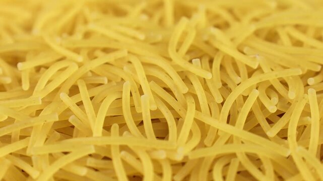 Uncooked vermicelli pasta texture circle rotation close up
