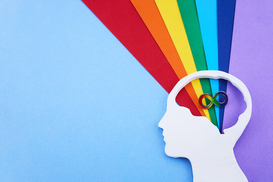 Human head silhouette with rainbow infinity symbol for neurodiversity