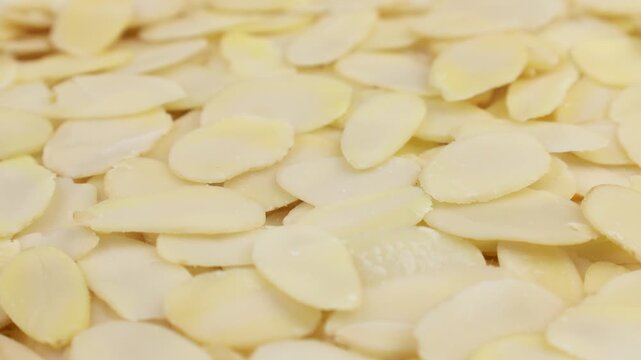 White almond petals texture circle rotation close up