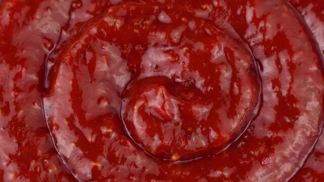 Red Arrabbiata sauce texture circle rotation close up top view