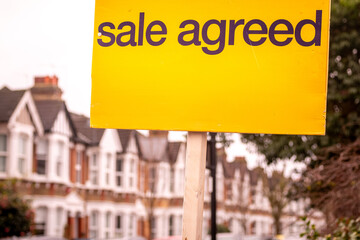 Fototapeta premium LONDON - Sale agreed sign in front of traditional red brick house