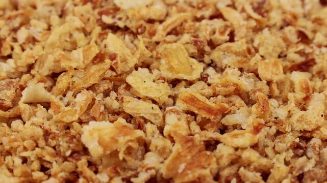 Organic crispy fried onions circle rotation close up top view