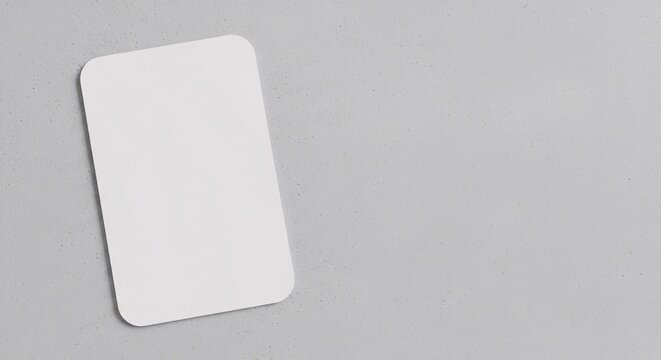Minimal blank card mockup with rounded corners on gray background. Perfect for business card, invitation, or branding presentation.