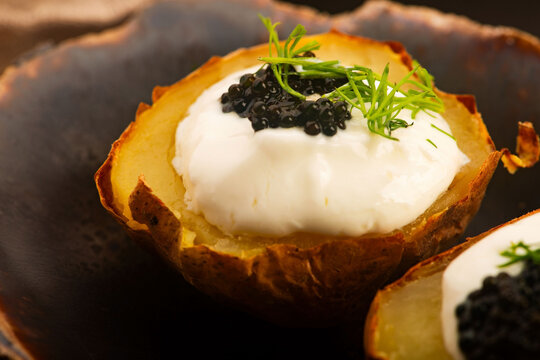 Roasted Potatoes with Yogurt and Tasha Fish Caviar on Handmade Ceramic Plate