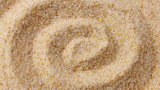 Dried granulated garlic texture circle rotation close up