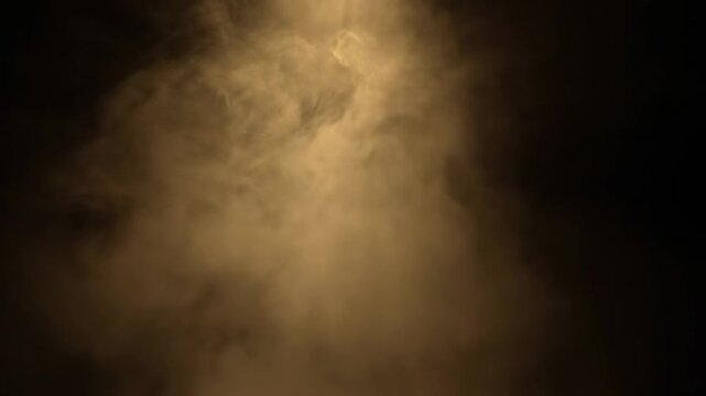 Soft and diffused cloud-like forms floating against a dark backdrop