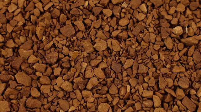 Brown instant freeze-dried coffee texture circle rotation close up