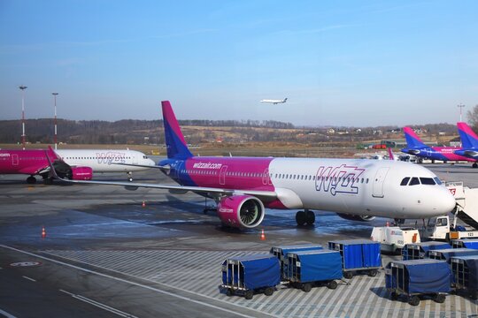 KRAKOW, POLAND - FEBRUARY 13, 2022: Aircraft of Wizzair low cost airline at Krakow Airport in Poland. It is the second busiest airport in Poland.