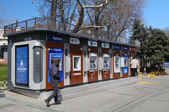ISTANBUL, TURKEY - MARCH 25, 2023: Row of ATM cash machines in a street of Istanbul, Turkey. Multiple bank brands: Akbank, Halkbank, Qnb Finansbank, YapiKredi and TEB.
