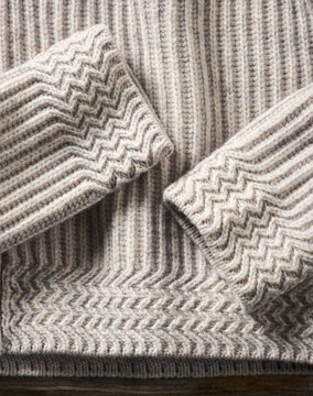 Close-up of a textured knitted sweater in a subtle zigzag pattern. Germany