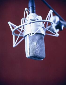 Close-up of a professional studio microphone against a dark background. Germany