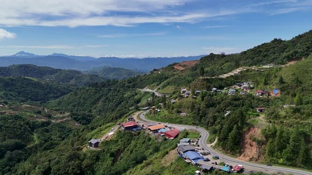 Aerial view of highway with Mount Tambuyukon in the background near Kundasang Town Ranau Sabah Malaysia