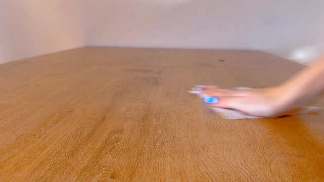 woman cleaning tabel