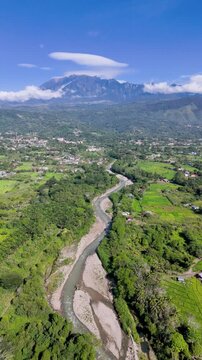 Aerial View of Mount Kinabalu, Liwagu river and Paddy Field in Ranau, Sabah, Malaysia