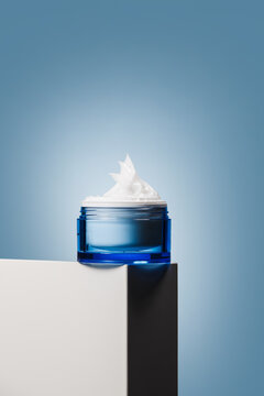 Blue moisturizer jar with whipped cream texture