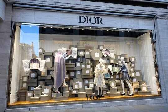 A visual merchandising display at the Dior retail boutique located at 160 to 162 New Bond Street, Mayfair. The display is inspired by the brand's historic 'Colifichets' grey boxes.