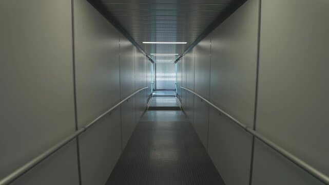 Modern Jet Bridge Interior at Airport Terminal Boarding Gate Walkway for Travel and Aircraft Access