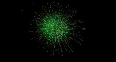 Fototapeta premium Dynamic green fireworks explosion on a black canvas offering ample negative space
