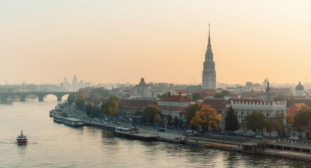 Obraz premium Expansive morning panorama showing a significant city tower and traditional temple alongside a river