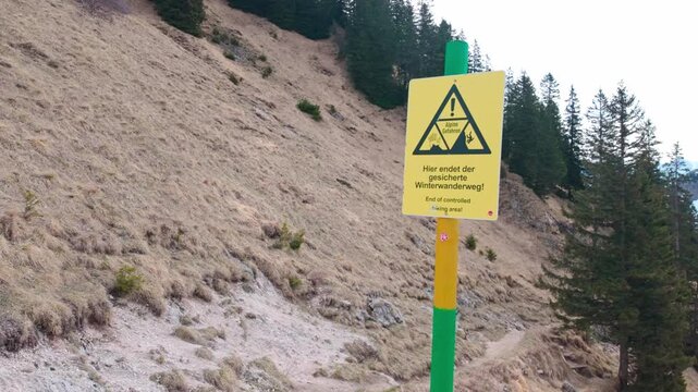 warning sign on mountain path