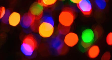 Obraz premium Seasonal design featuring motion blurred holiday lights in vibrant colors