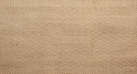 Fototapeta premium A close-up view of natural burlap fabric showing its distinctive coarse texture and woven threads in a uniform brown hue