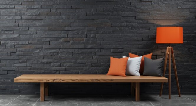 Modern design concept featuring dark grey stone wall wooden bench orange lamp and layered pillows