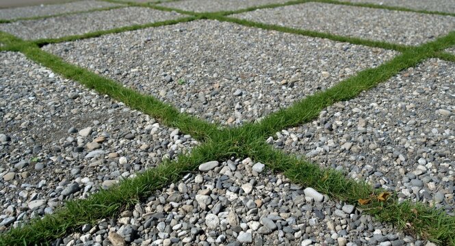 Gravel infilled joints in grass paving enhance parking area durability and grass health