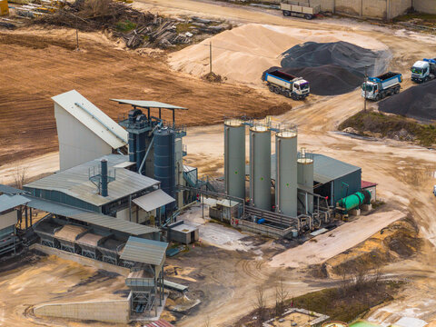 Aerial view of an industrial plant with a mix of textures and tones, contrasting with the natural landscape, Magliano de' Marsi, Abruzzo, Italy.