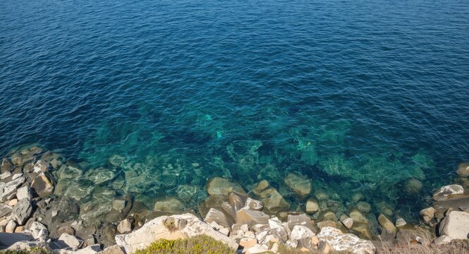 Natural seaside bay with rocky boundary and tranquil water