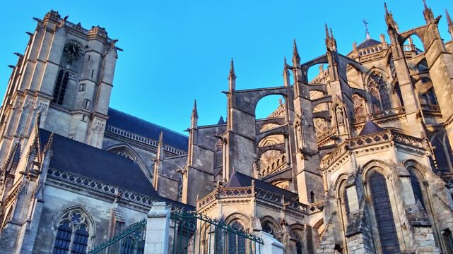 Low-angle panning shot of the Le Mans Cathedral aka Cathedral of Saint Julian facade exterior details, Le Mans, France
