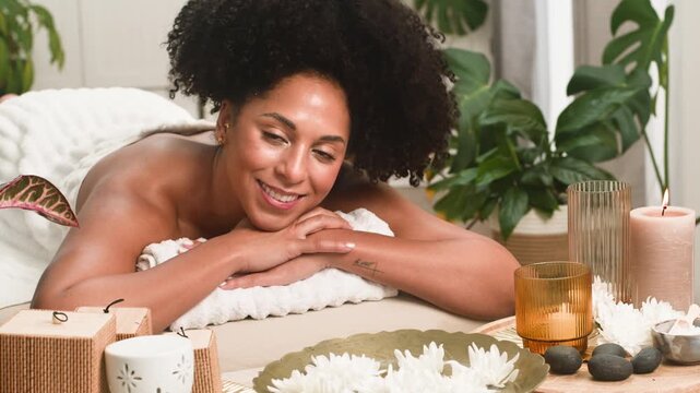 Happy Black Woman Enjoys a Relaxing Spa Treatment for Ultimate Well-Being and Self-Care