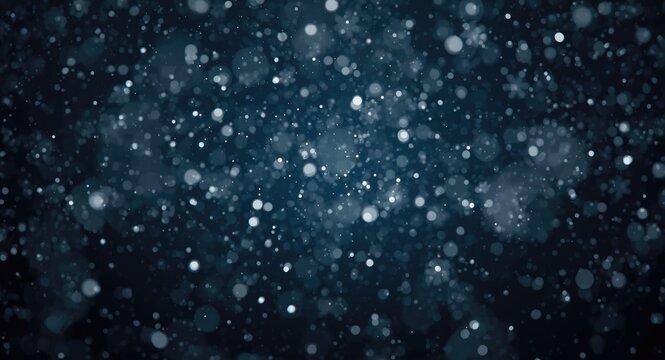 Detailed blizzard effect with snowflakes blurred on a deep dark background