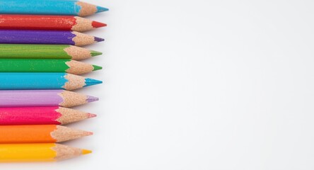 Fototapeta premium Colorful pencil tips on white background emphasizing office supply essentials