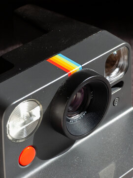 Polaroid instant camera with autofocus lens and rainbow stripe. Kyiv, Ukraine - March 17, 2026.