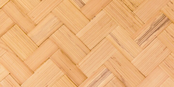 Close-up of light natural woven bamboo lattice texture.