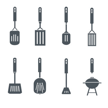 Collection of kitchen utensils and barbecue tools for cooking and grilling outdoors