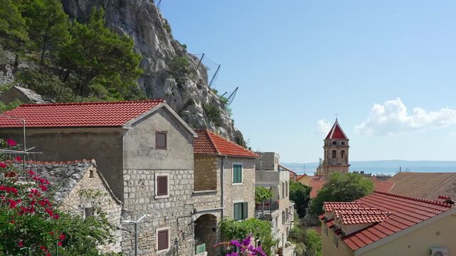 Historic old town of Omis with traditional red tile roofs.