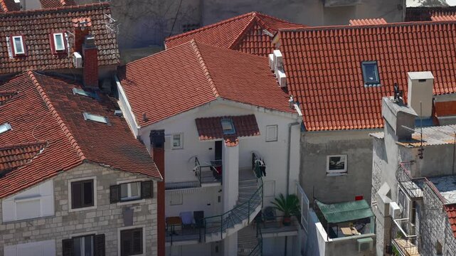 Traditional Mediterranean houses with red clay tile roofs.