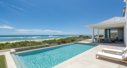 Fototapeta premium Modern coastal villa with a serene pool area and beach access