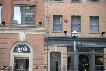Naklejka premium exterior building facade and sign of McCain Foods Limited (439 King W) and SOMA Chocolatemaker (443 King St W), Toronto