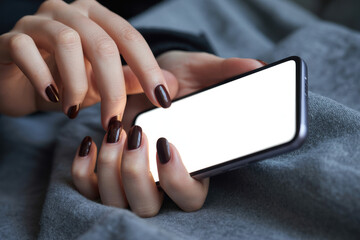 Obraz premium Mockup woman's hand holding using smart phone with white blank screen at coffee shop, mobile app design and advertising, online marketing, close up 
