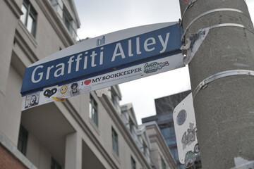 Naklejka premium City of Toronto location marker for Graffiti Alley with stickers, at Augusta Av