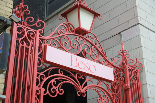 elegant gate with sign of Beso by Patria, a Spanish restaurant, located at 478 King St W, Toronto