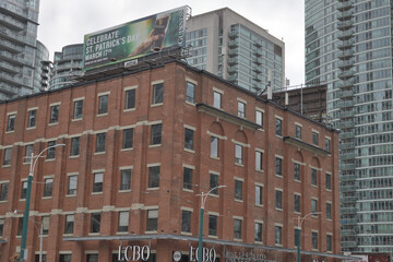 Naklejka premium old building and sign of LCBO, a liquor store chain, located here at 49 Spadina Av, Toronto